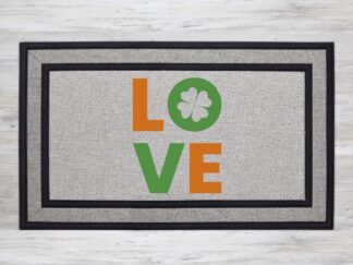 Mockup of a St. Patrick's Day themed welcome mat featuring the phrase, "LOVE" with a green shamrock cut out in the letter 'O'.