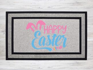 Mockup of an Easter themed doormat that features the phrase "Happy Easter" with a pair of delightful bunny ears over the 'E' in Easter.