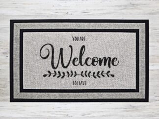 Mockup of a funny welcome mat featuring the phrase, "you are welcome to leave" with the 'welcome' very large compared to the other words