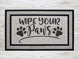 Mockup of doormat inspired by pet lovers featuring the phrase, "wipe your paws" in a bold black font