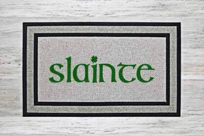 Slainte doormat with shamrock accent over the letter i