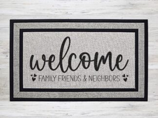 Mockup of a welcome doormat that says "welcome, family, friends & neighbors!" with cute heart flourishes.
