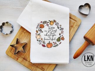 Fall dish towel with wreath design and phrase Fall is Proof That Change is Beautiful