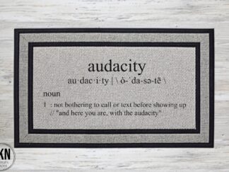 Mockup of a snarky doormat that features the definition of audacity, not bothering to call or text before showing up.