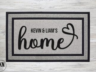 Home with heart flourish and first names doormat