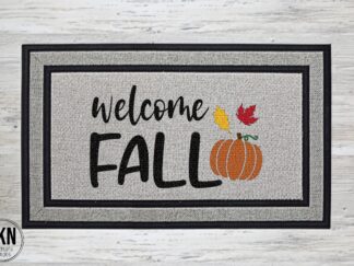 Mockup of a doormat that says "welcome fall" with a cute pumpkin and some fall leaves