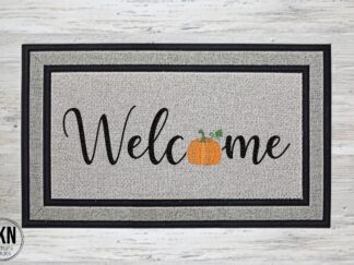 Mockup of a doormat that says "welcome" with a pumpkin in place of the letter "O".