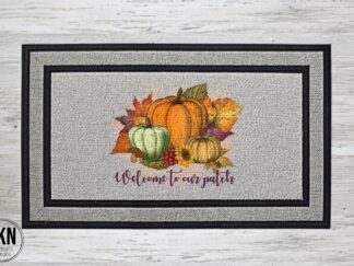 Mockup of the Welcome to Our Patch doormat featuring a harvest scene with pumpkins, sunflowers and fall leaves