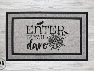 Mockup of a Halloween themed doormat that says "Enter if you dare".