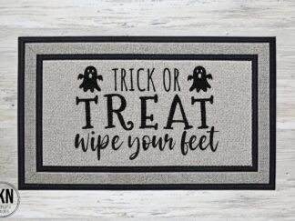 Mockup of a Halloween themed doormat that says "Trick or Treat wipe your feet".