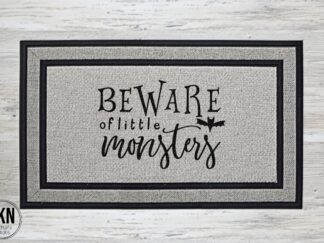Mockup of a Halloween themed doormat that says "Beware of Little Monsters".