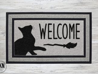 Mockup of a Halloween themed doormat that says "welcome" in a bold black font with a black cat swatting at a broom under the word welcome.