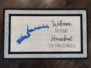 Photo of a doormat for a client at Atwood Lake in Ohio, for the Mallernees family, that says "Welcome to our Houseboat, The Mallernees" with a cartography map of Atwood Lake.