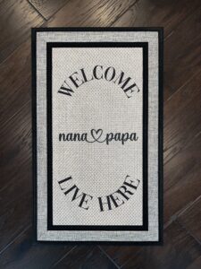 Photo of a custom order for client's parents that says, 'Welcome Nana & Papa Live Here"
