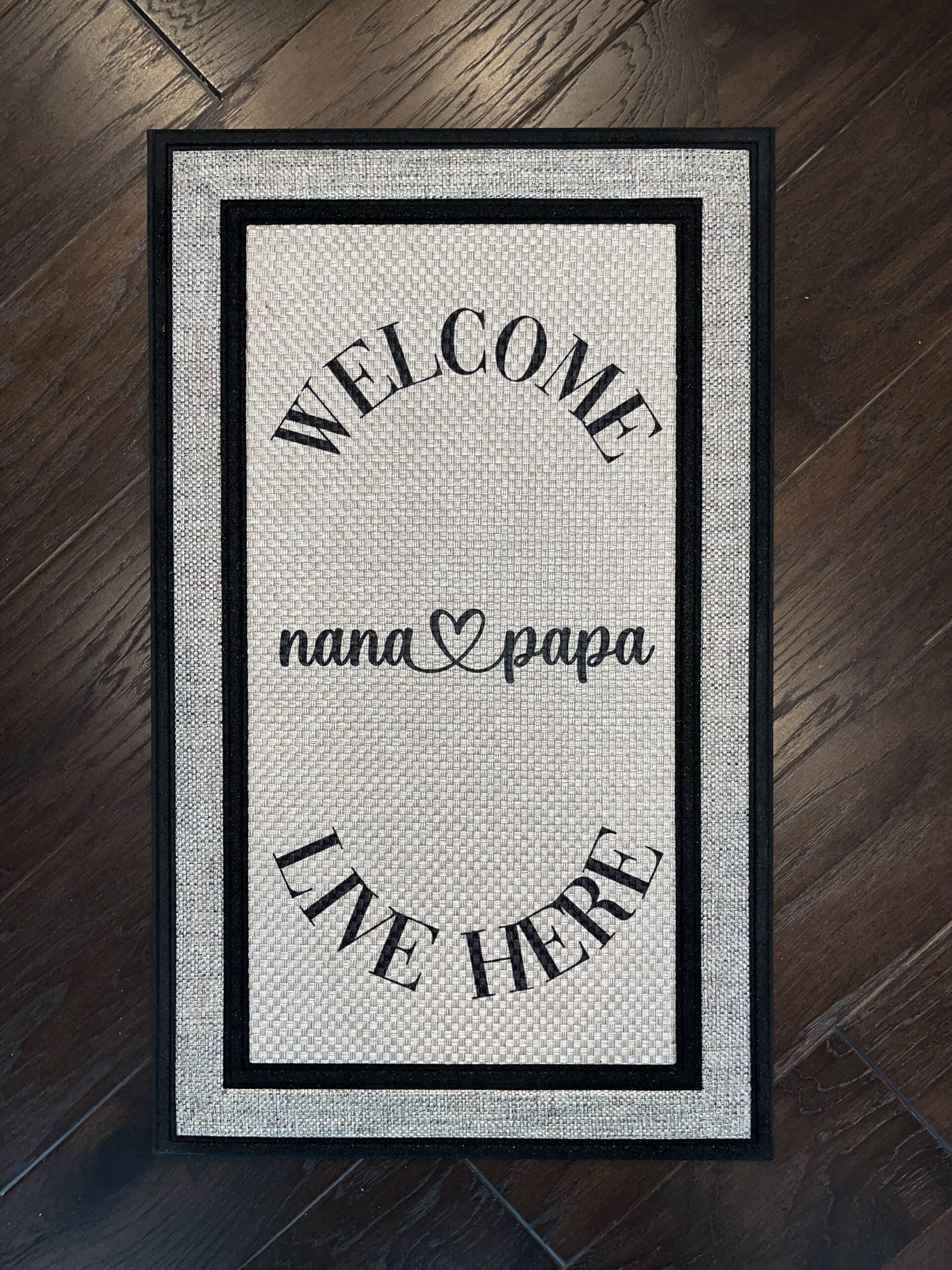 Photo of a custom order for client's parents that says, 'Welcome Nana & Papa Live Here"