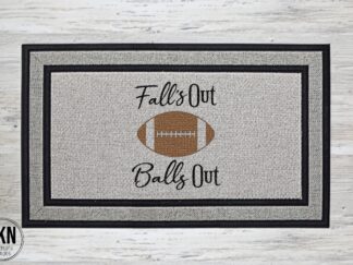Mockup of a football themed doormat that reads, "Fall's Out Balls Out" around a large football