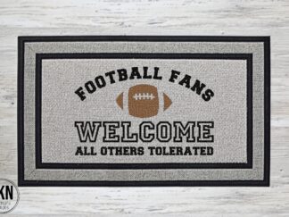 a football themed doormat that reads Football Fans Welcome - All Others Tolerated" surrounding a large football
