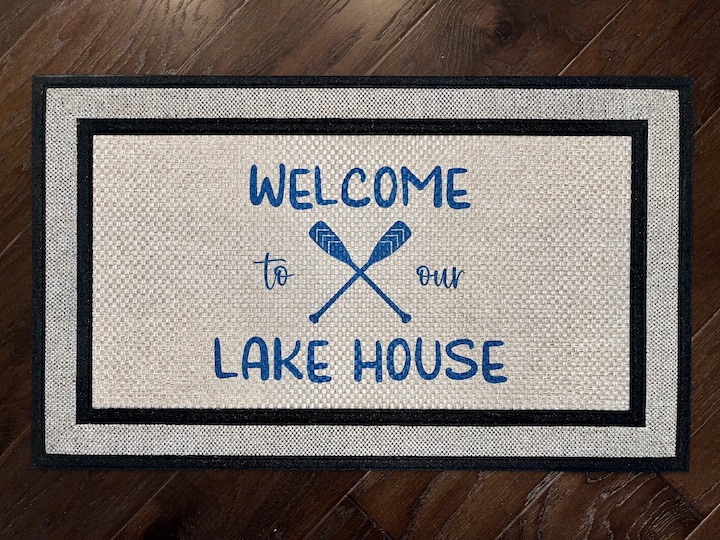 Photo of client order of a lake themed doormat featuring the phrase Welcome to our Lake House