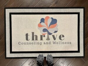 Photo of a custom doormat in our larger size 30"x47" for their company