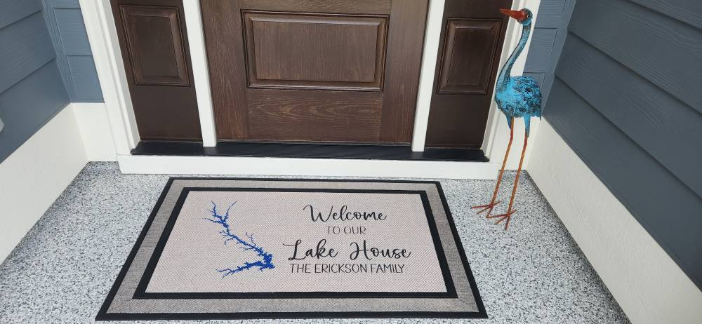Client photo of our large doormat (30" x 47") with a custom lake design at their home at Lake Strom Thurmond