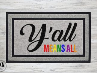 Mockup of a pride themed doormat featuring the phrase Y'all Means All