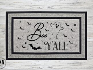 Mockup of a Halloween themed doormat with the phrase Boo y'all, surrounded by a number of spooky bats.