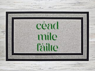 Cead Míle Failte doormat with bold green lettering