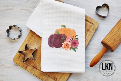 Fall dish towel with watercolor pumpkins and autumn flowers