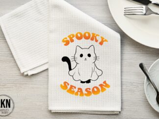 Halloween dish towel with cat dressed as ghost and Spooky Season text