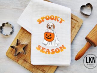 Halloween dish towel with dog dressed as ghost and Spooky Season text