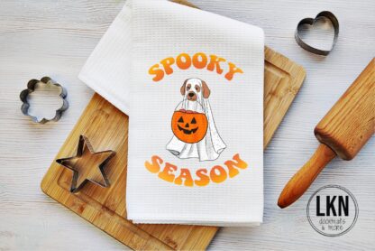 Halloween dish towel with dog dressed as ghost and Spooky Season text