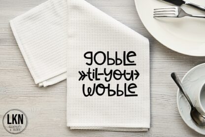 Thanksgiving dish towel with Gobble Til You Wobble design